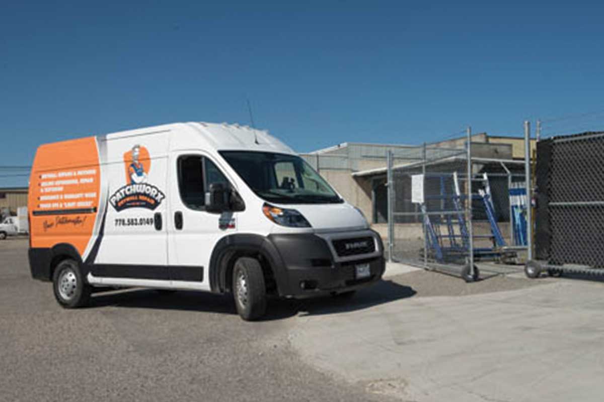 Red lock storage Patchwork fleet van coming into lot