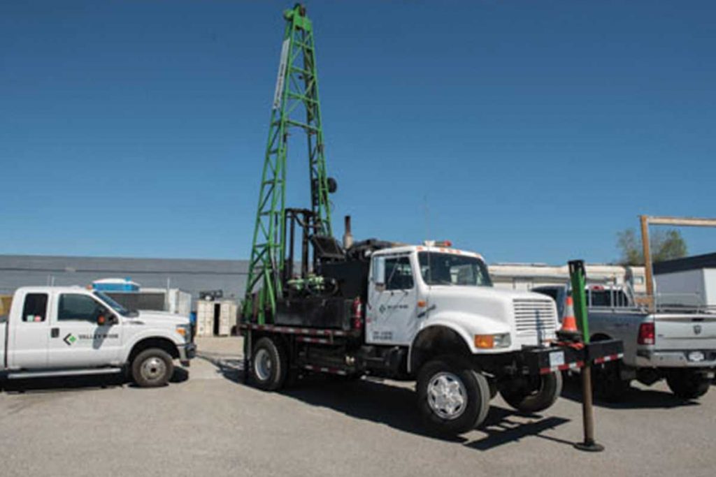 Red lock storage truck with tall crane in lot