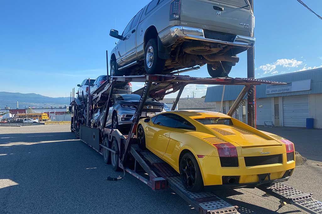 Red Lock Storage sports car being delivered to lot